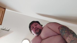 Large Chubby Man Bending Over To Reveal His Behind