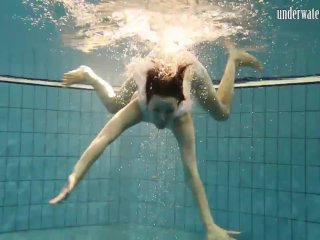 Hot babe swims_in the sea like a mermaid