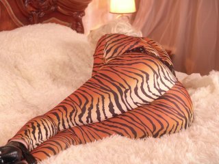 Submissive MILF gagged and bondage taped in spandex catsuit