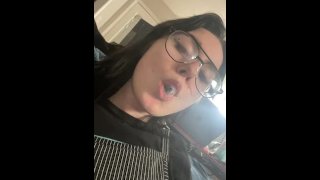 Hot girl with glasses shows off spit bubble