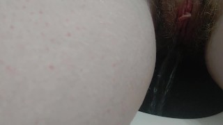pissing young redhead with big tits pisses on webcam