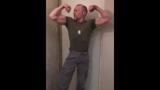Muscular Army Man Flexing His Biceps And Preparing To Fight
