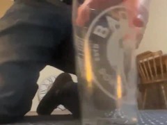 Video Pissing into a pint glass - feeling horny while I’m doing it
