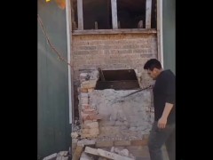 Demolishing a brick chimney