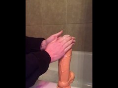 Oiling up my thick dildo