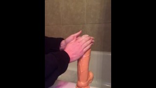 Oiling up my thick dildo