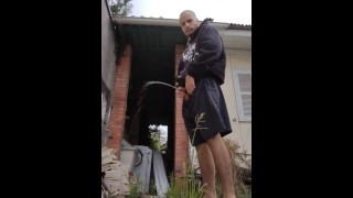 Master peeing in backyard, abandoned house