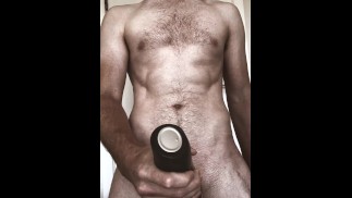 Sir oils and strokes his massive cock with a Satisfyer before offloading a huge cumshot