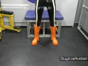 Preview 1 of Hot Guy in Shiny Tight Black Rubber Leggings & Top & Bright Orange Boots Jerking His Huge Wet Cock.