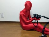 Respiratory control with gas mask on red zentai