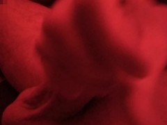Playing with my balls and cock in pink light
