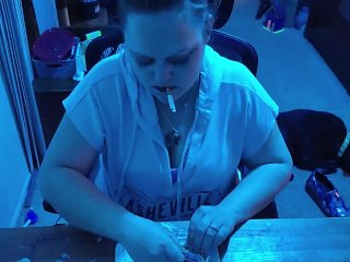 Sexy brunette smoking cigarette while talking dirty and rolling us a joint!