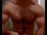 HAIRY MUSCLE BEAR FLEXING BEFORE SHOWER