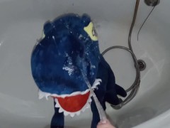 Blue dinosaur Peeing