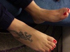 Milf shows her sexy feet with red nail polish,waiting for someone to lick them.....