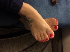 Milf shows her sexy feet with red nail polish