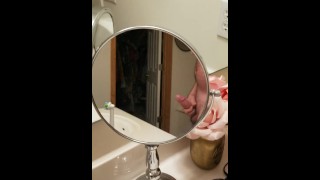 Stroking cock in mirror while watching pussy