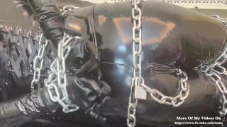 Metal bondage and latex hood play