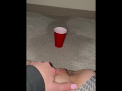 Piss spray into solo cup 