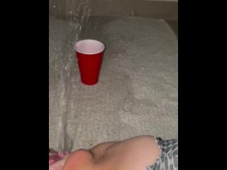 Piss spray into solo cup