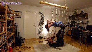 Suspension Of A Girl In Shibari Session With Three Transitions