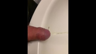 Close up dick peeing in sink