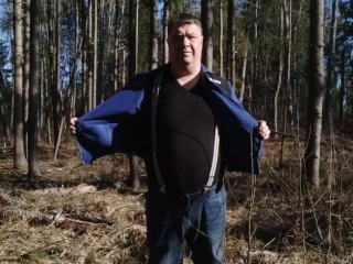 Undressing in a sunny spring forest for my fans