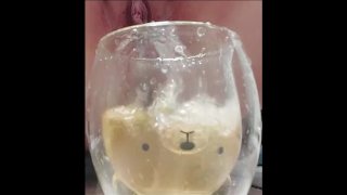 CreamyPussySlut pissing in a cup