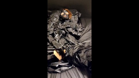 Solo masturbation in black PVC