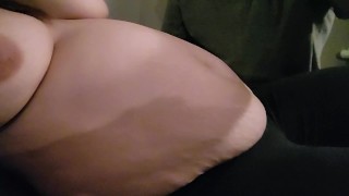 Boyfriend rubs girlfriends growing belly 