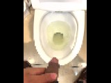 College student peeing in the bathroom