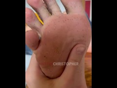 Slave licks dirty feet of sand