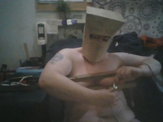 Fat Slut Pig With Bag on Her Head and Tits in Wooden Rack Masturbates on Egg Beater