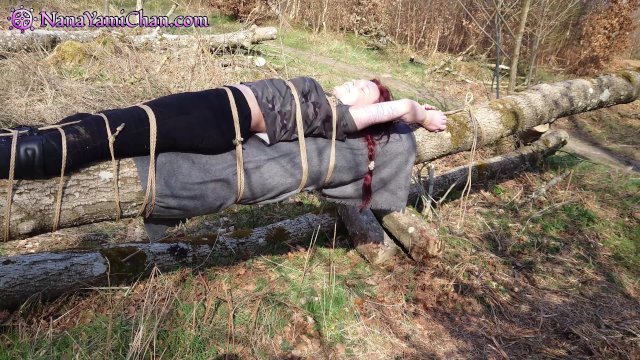 Watch Bondage Video:Girl tied to tree log in public forest: Breath control & teasing to orgasm!