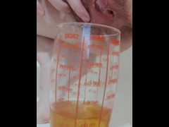 Morning piss in a measuring glass