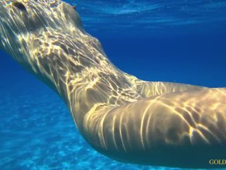 A Russian girl with a stunning body swims naked on a public beach. Tourists are thrilled!