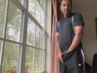 Undressing and cumming at the window