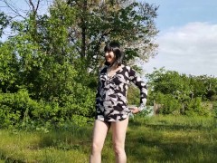 Beautiful trans girl collects dandelions in nature and shows her pussy