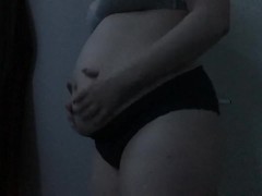 Feedee plays with empty and full bellyplay