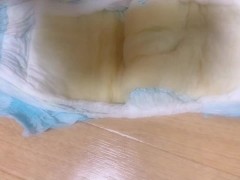 Peeing on top of a diaper training diaper