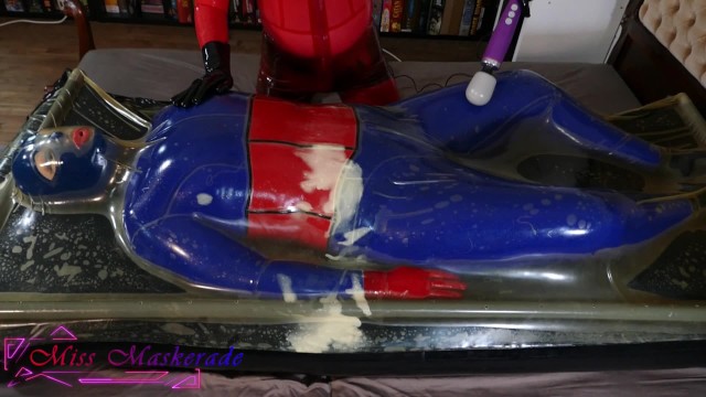 Miss Maskerade in Full Latex Vacbed Bondage Domination Play