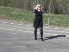 Business lady flashing on the road