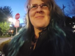 MILF pissing and playing with her pussy  in public parking at a fair