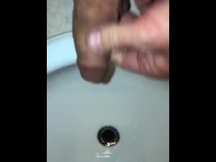 Pissing In The Bathroom Sink Using The Drain As A Target