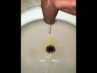 Pissing In The Bathroom Sink Using The Drain As A Target