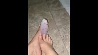 Giving my dildo a footjob with my sexy feet
