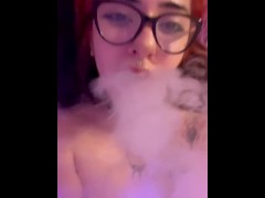I smoke and smoke falls on a shaved pussy