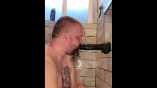 Slave practices cock sucking on dildo