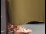 Sexy feet of a French girl in the fitting room of a sports store