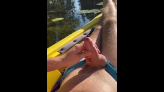 Hairy daddy long legs pumps his tight uncut cock in a kayak